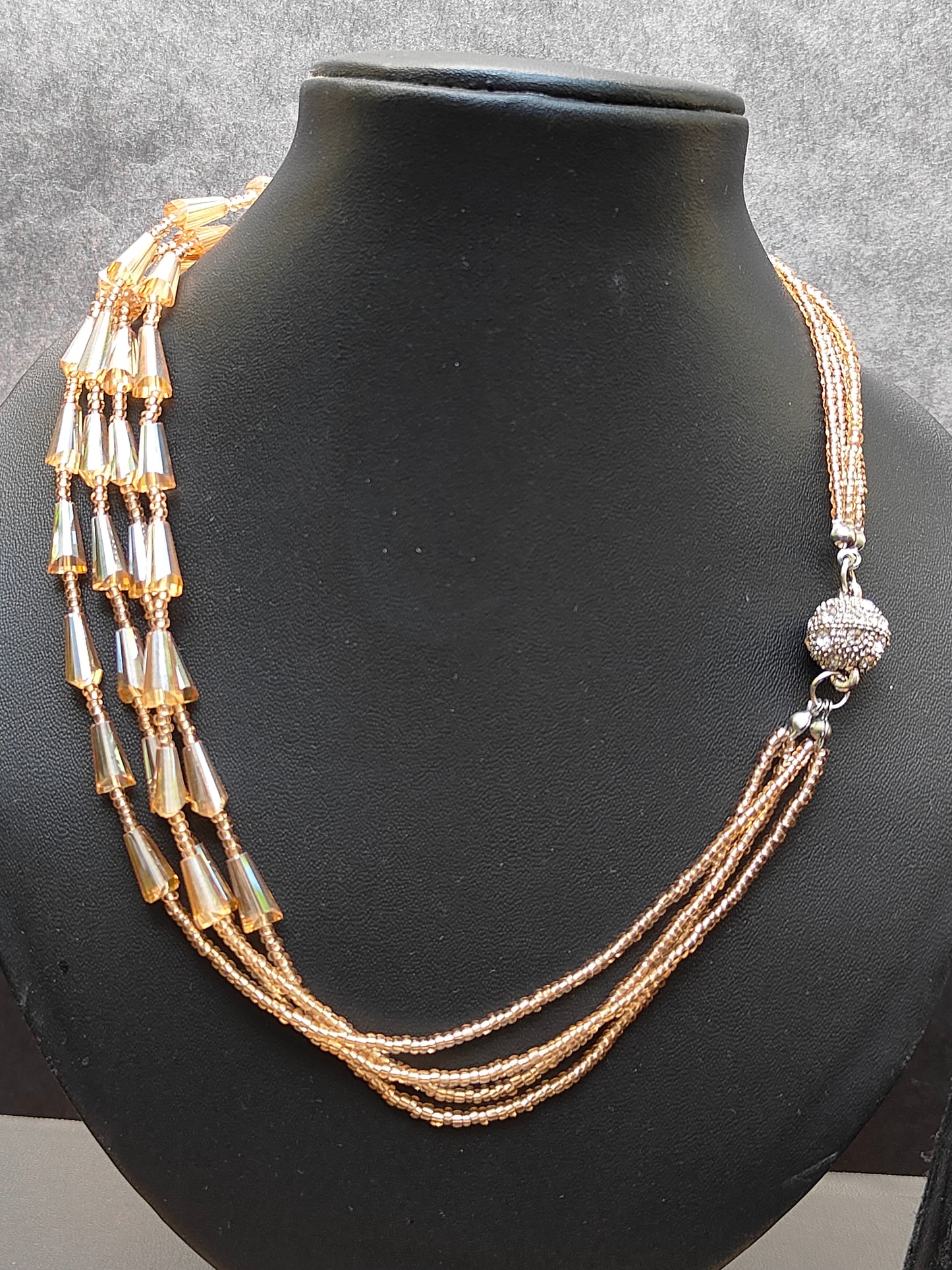 Multiple layered golden neckpiece